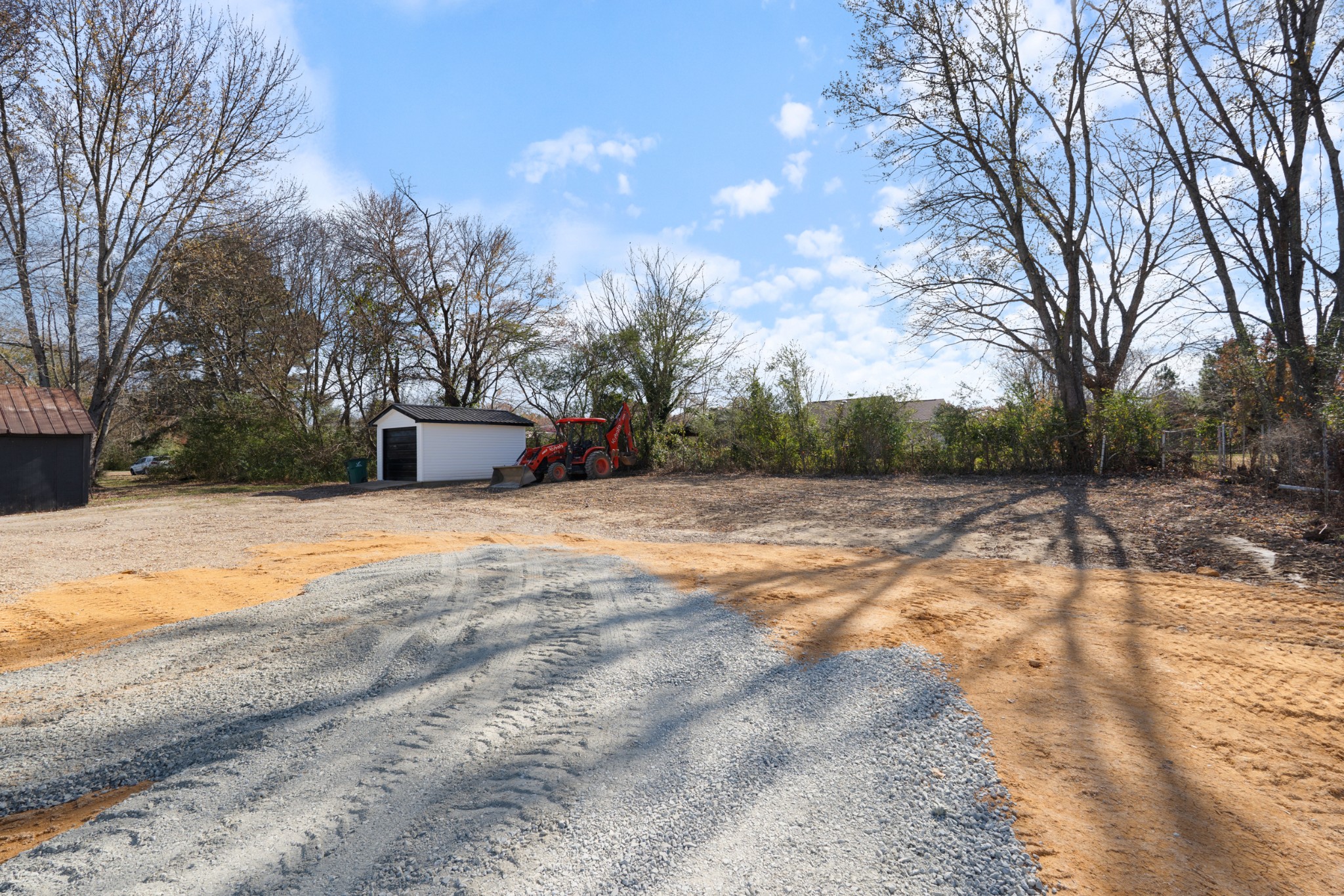 654 West Main Street Hohenwald, TN 38462 - Photo 4 of 33 a view of a yard with trees