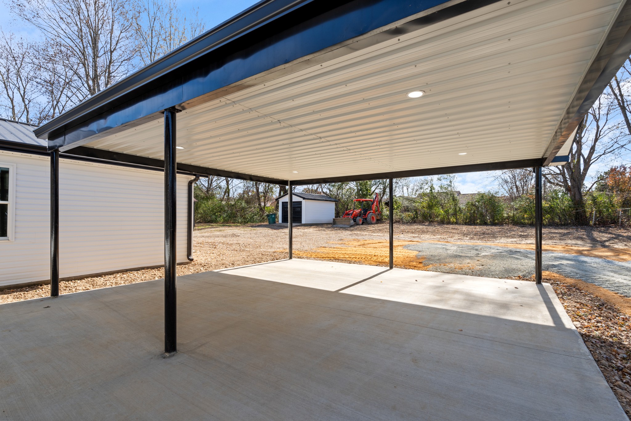 654 West Main Street Hohenwald, TN 38462 - Photo 7 of 33 a view of an empty room with wooden floor and fence