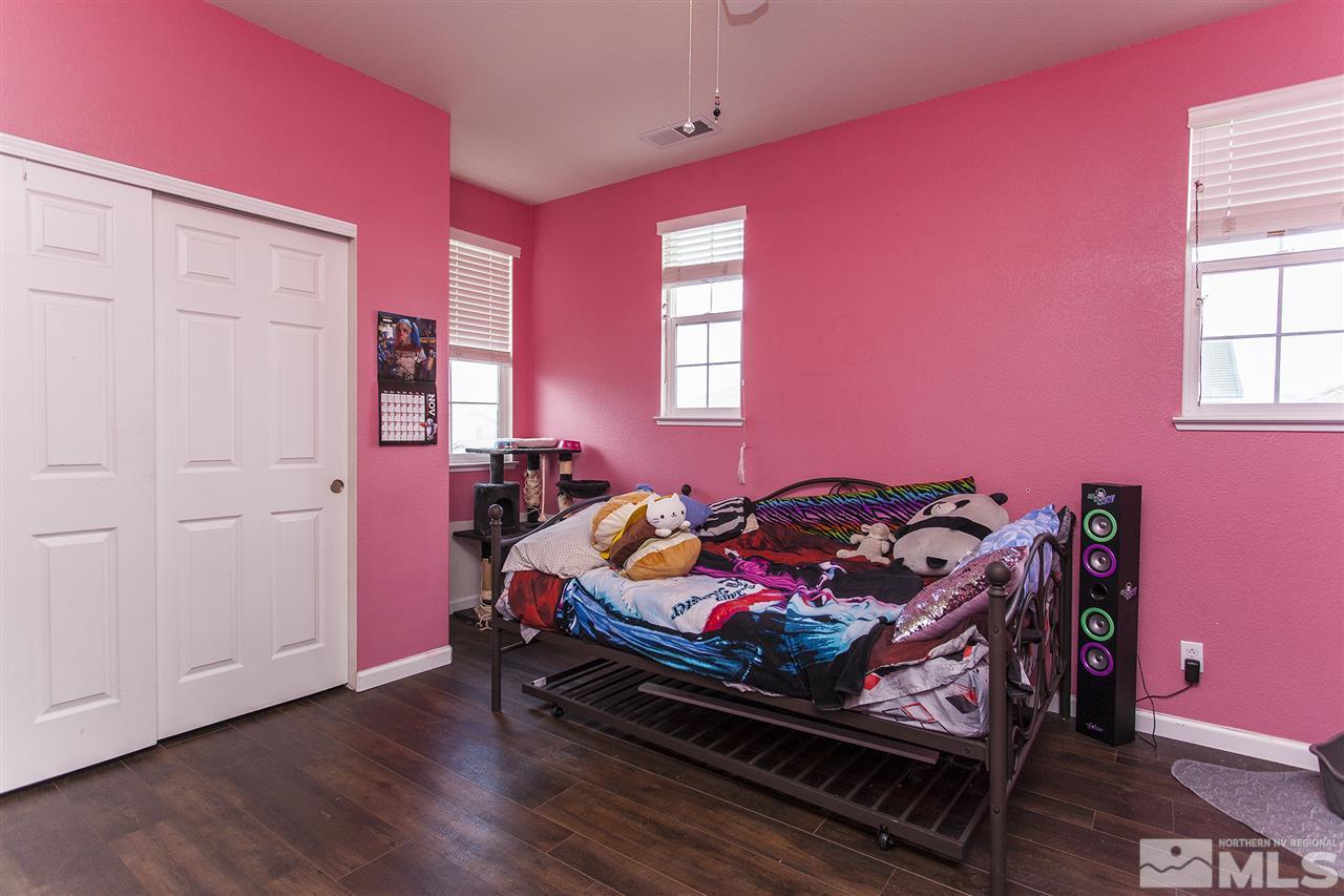 570 Needles Court Reno, NV 89521 - Photo 14 of 18 a bedroom with a bed and a window