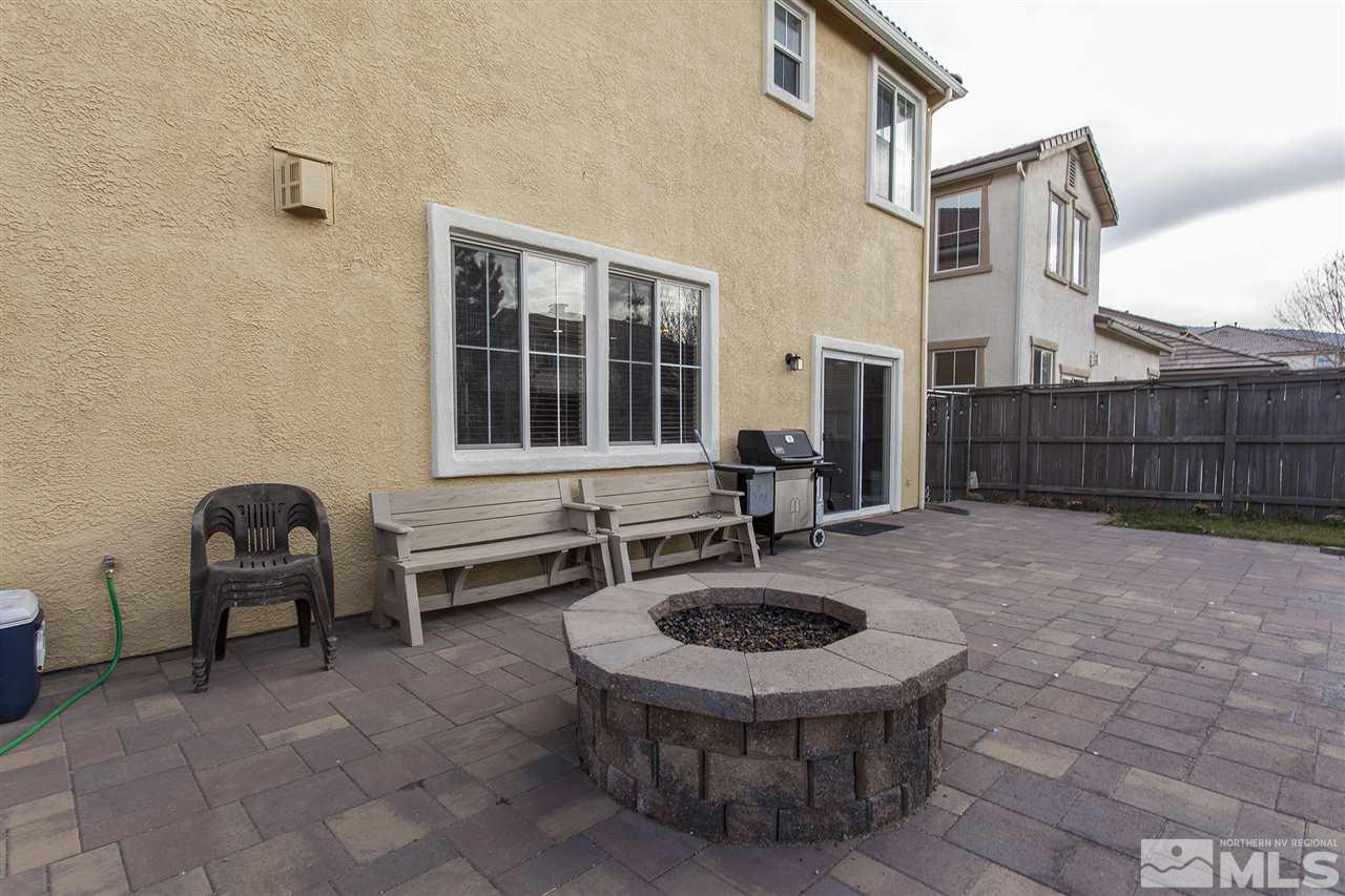 570 Needles Court Reno, NV 89521 - Photo 2 of 18 a view of a patio with table and chairs