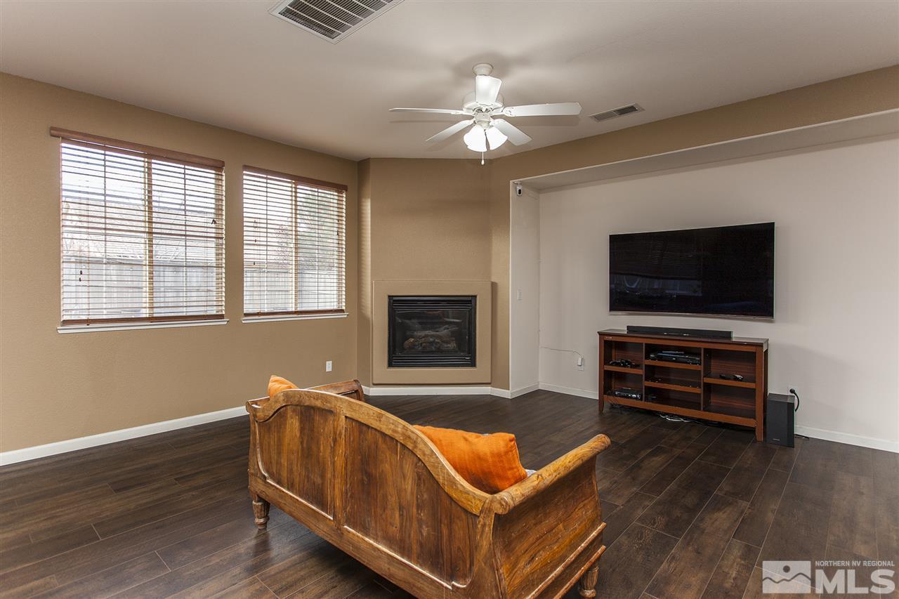 570 Needles Court Reno, NV 89521 - Photo 3 of 18 a living room with furniture and a flat screen tv