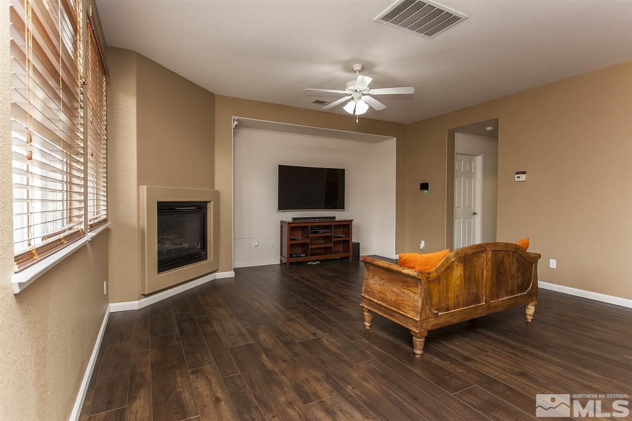570 Needles Court Reno, NV 89521 - Photo 4 of 18 a living room with furniture and a flat screen tv