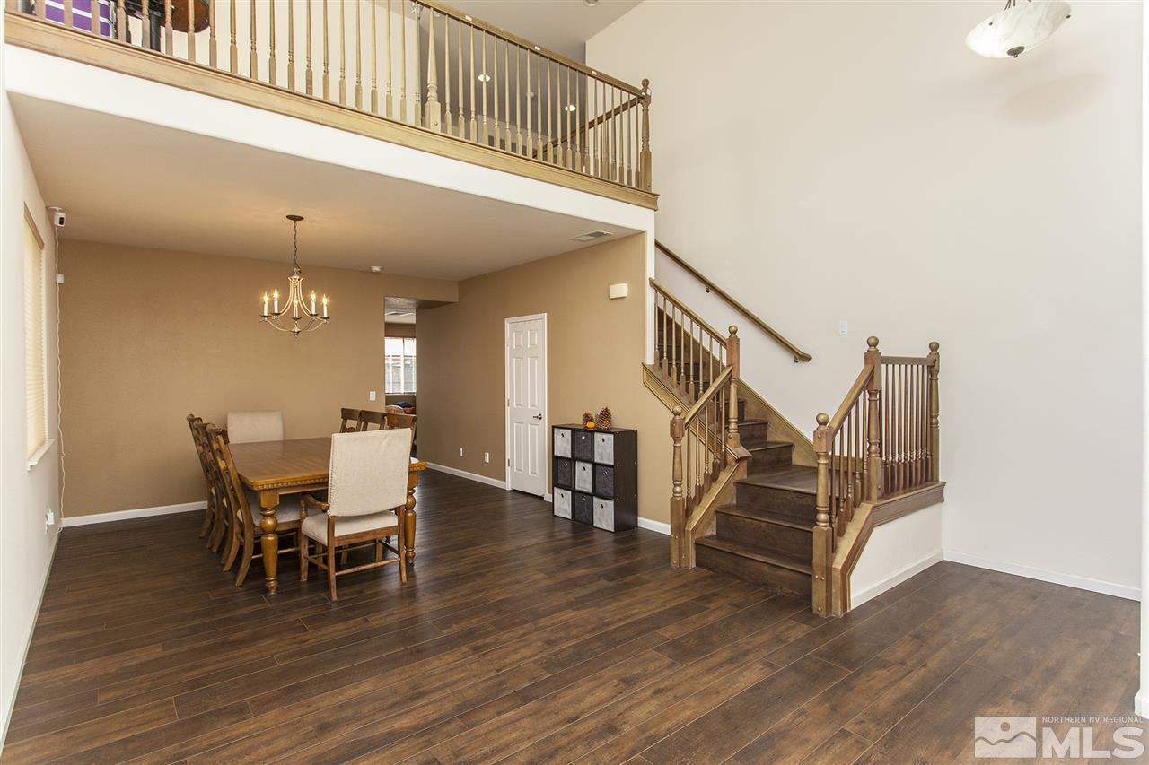 570 Needles Court Reno, NV 89521 - Photo 8 of 18 a view of a dining room with furniture and wooden floor