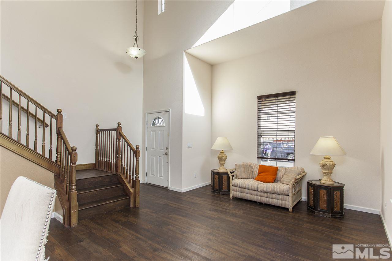 570 Needles Court Reno, NV 89521 - Photo 9 of 18 a bedroom with furniture and wooden floor