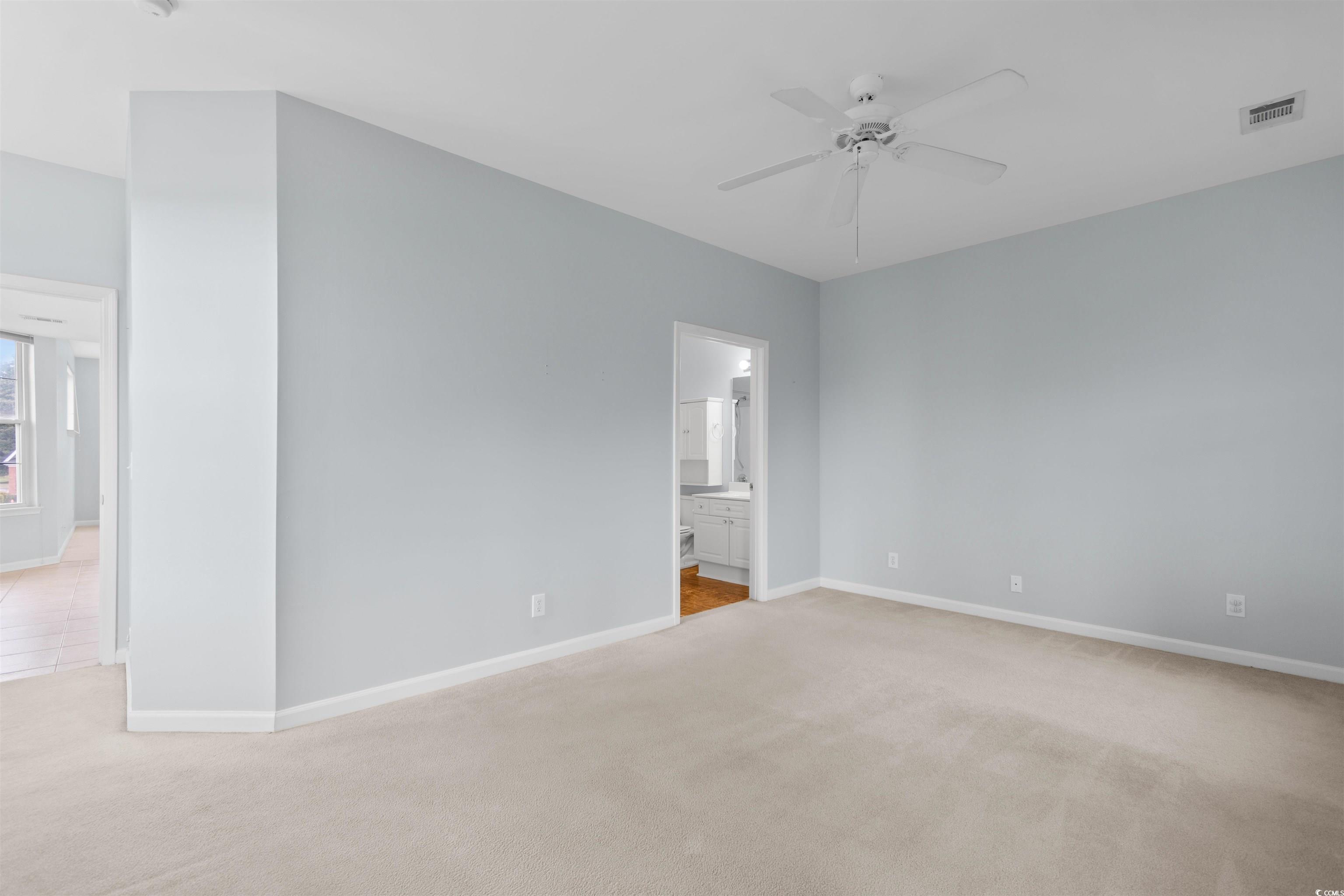 4430 Lady Banks Lane, Unit A2 Murrells Inlet, SC 29576 - Photo 20 of 31 Spare room featuring light carpet and a ceiling fan