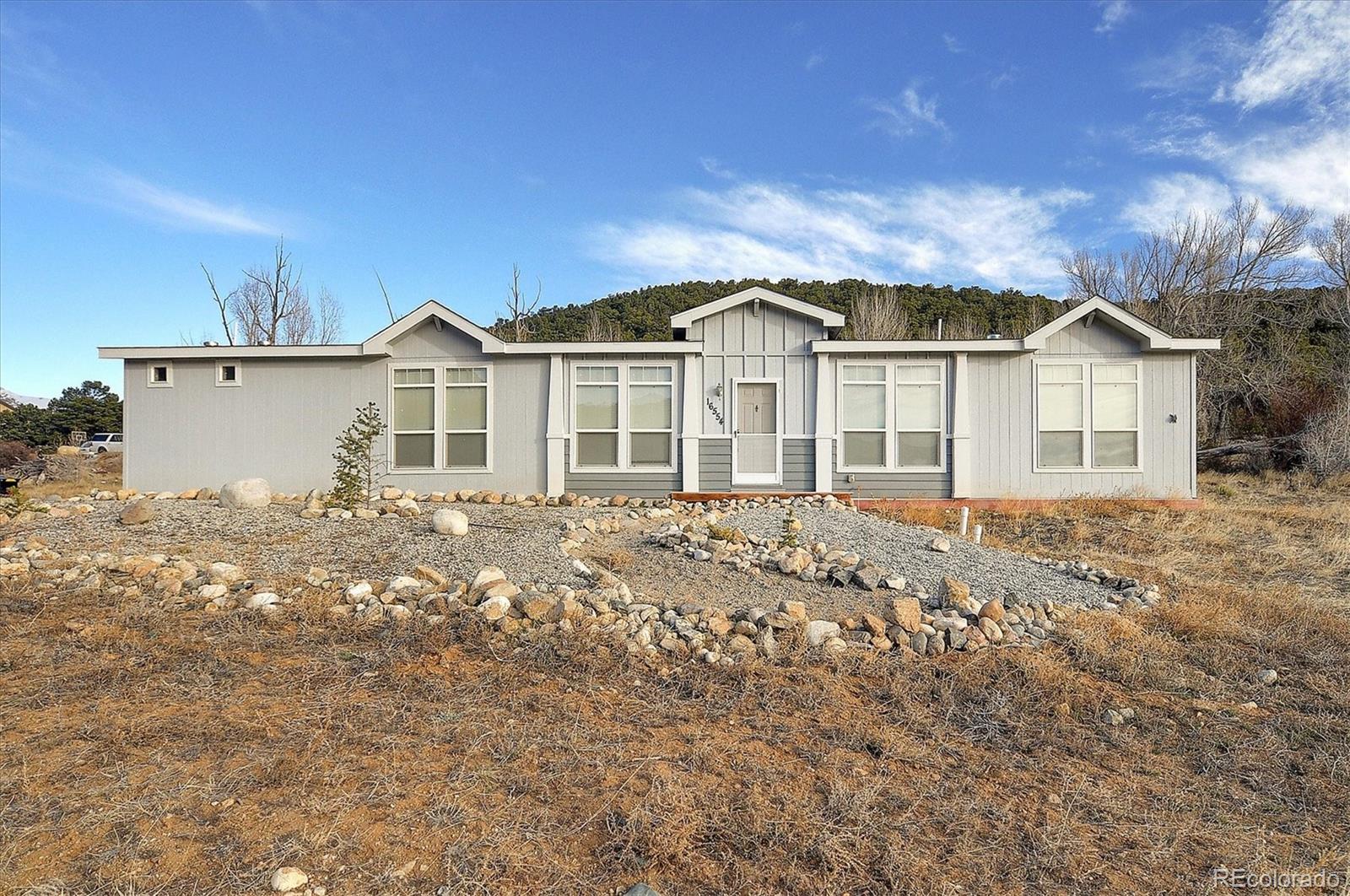16554 Rocky Mountain Road Salida, CO 81201 - Photo 1 of 33 front view of a house with a yard