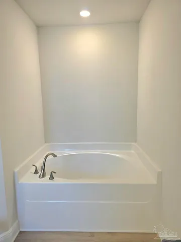 a bathroom with bathtub