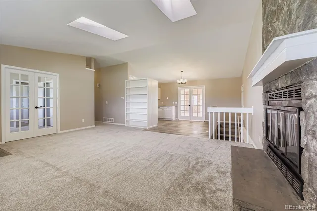 a view of kitchen with stainless steel appliances refrigerator oven and cabinets