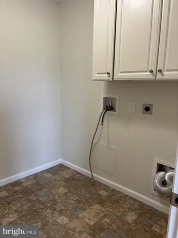 a bathroom with a toilet sink and vanity