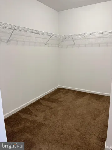 a bathroom with a double vanity sink and a toilet