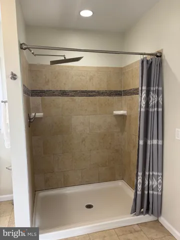 a living room with furniture a rug and a large window