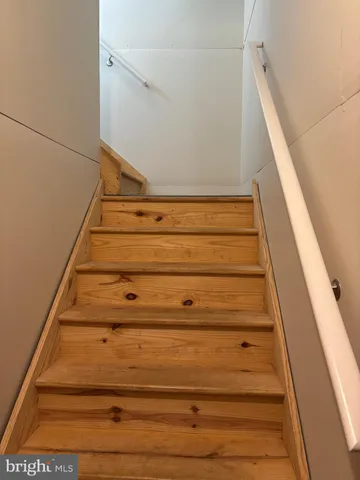 a utility room with multiple dryer and washer