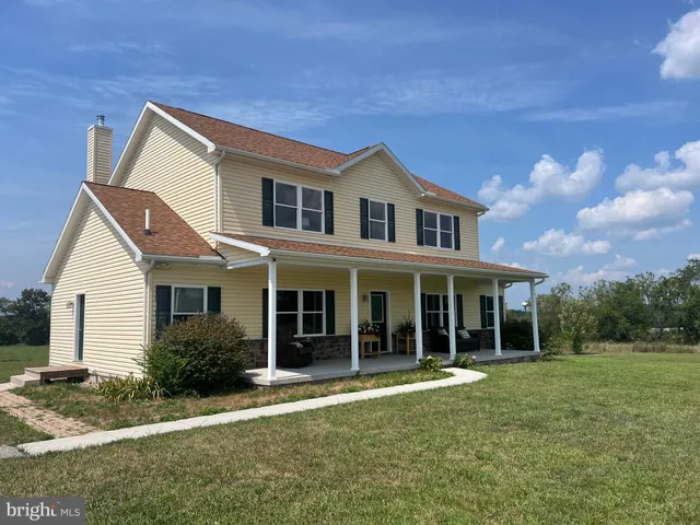 a kitchen with stainless steel appliances granite countertop a sink and a stove