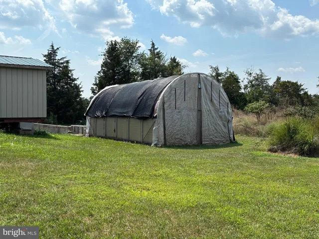 a view of a house with a wooden deck