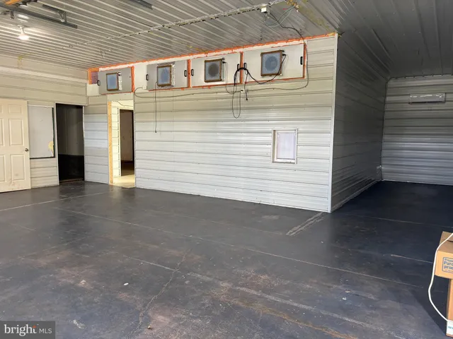 a view of an empty room with a fireplace