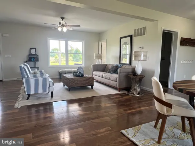 a view of cabinets and utility room with window