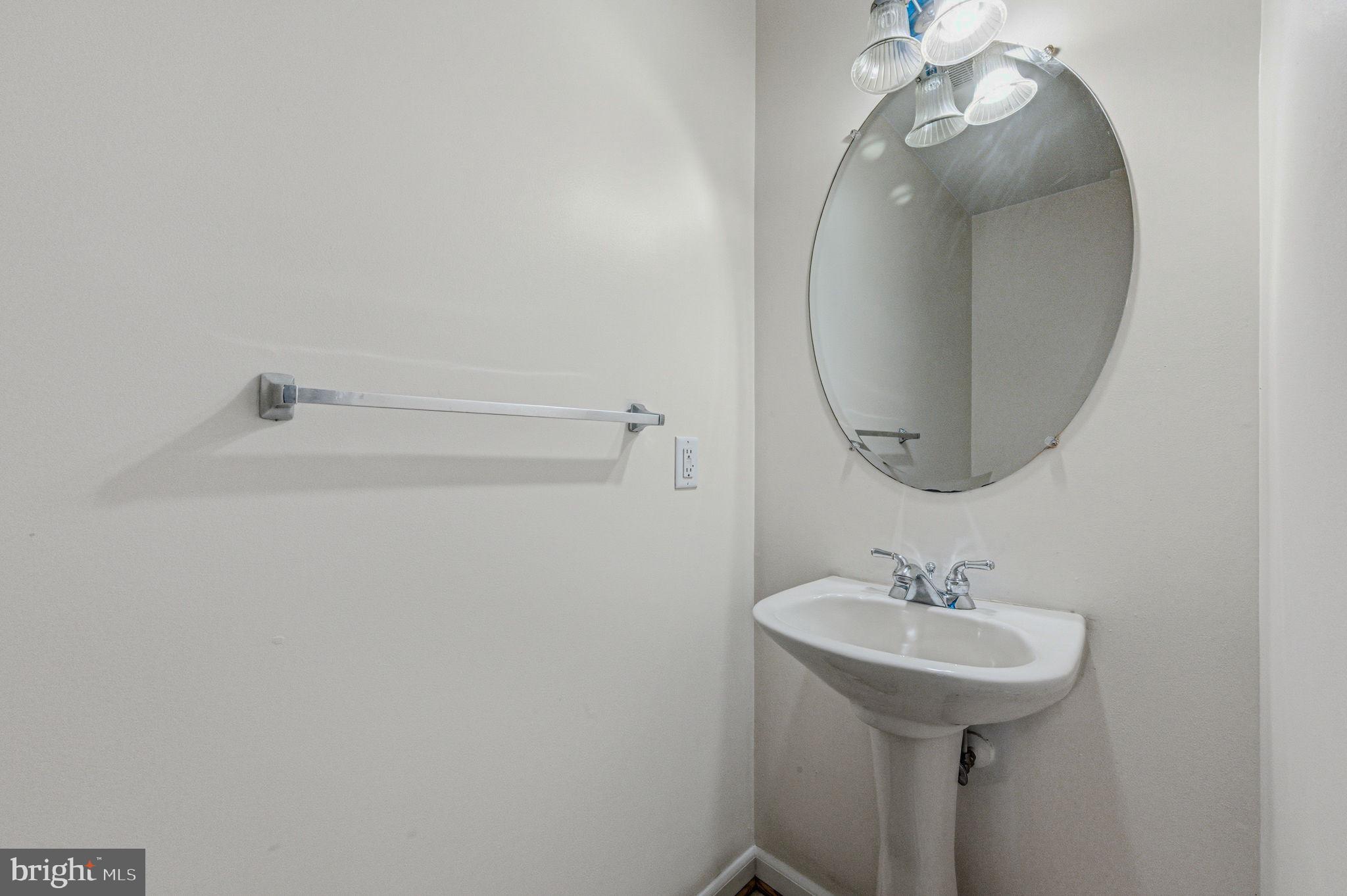 99 Jack's Way Camden, DE 19934 - Photo 16 of 30 a bathroom with a sink and mirror