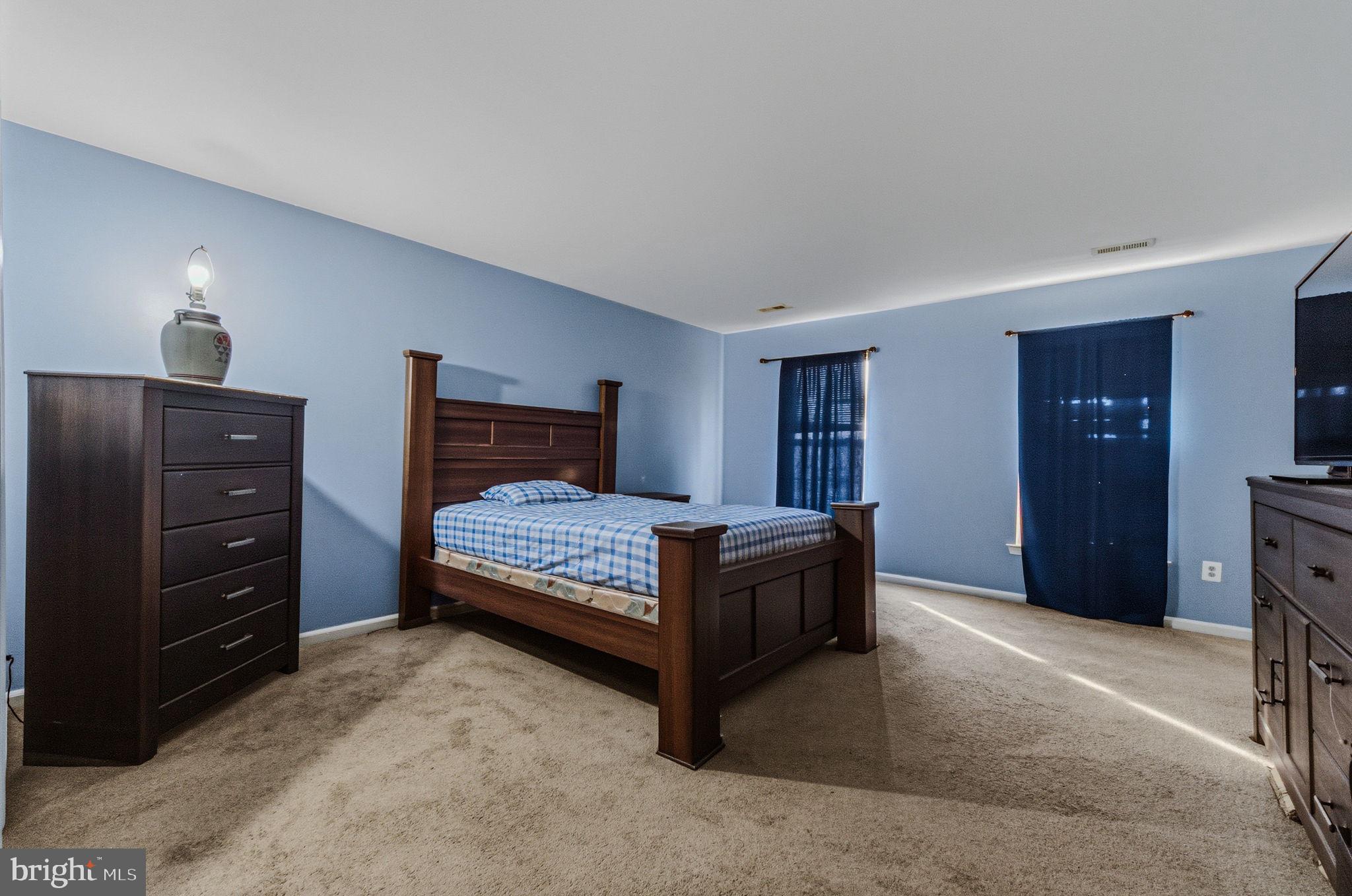 99 Jack's Way Camden, DE 19934 - Photo 17 of 30 a bedroom with a bed and a closet