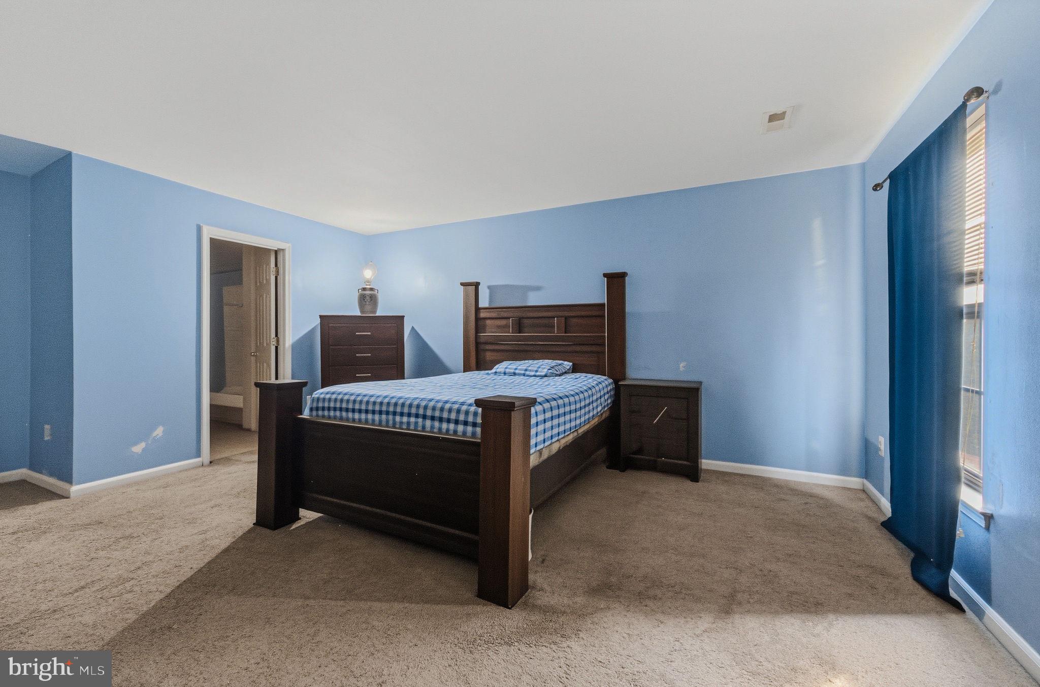 99 Jack's Way Camden, DE 19934 - Photo 18 of 30 a bed room with a bed and a night stand