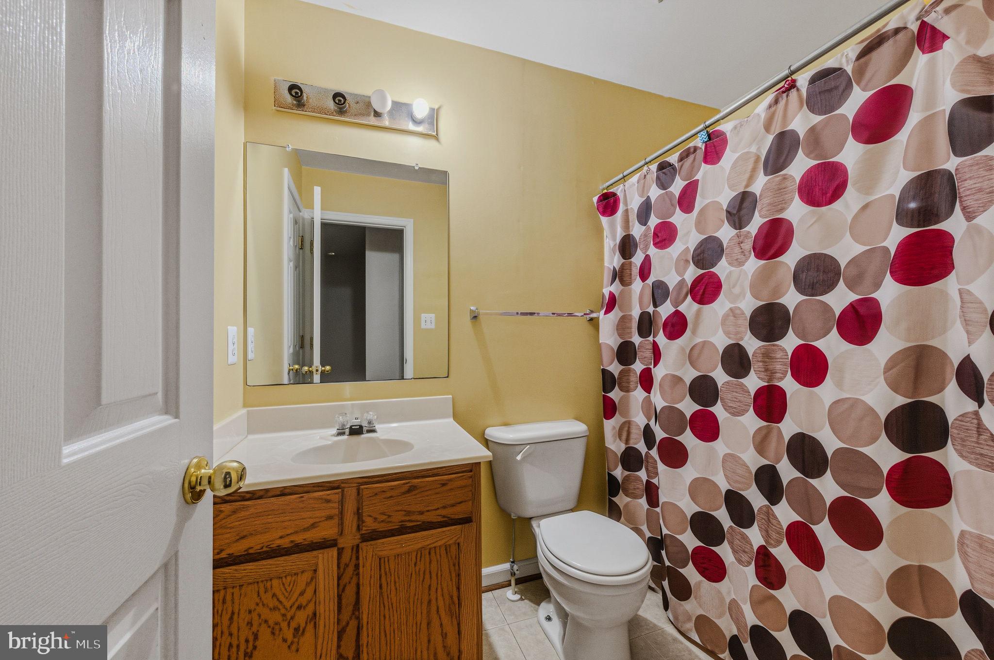 99 Jack's Way Camden, DE 19934 - Photo 22 of 30 a bathroom with a sink and a mirror