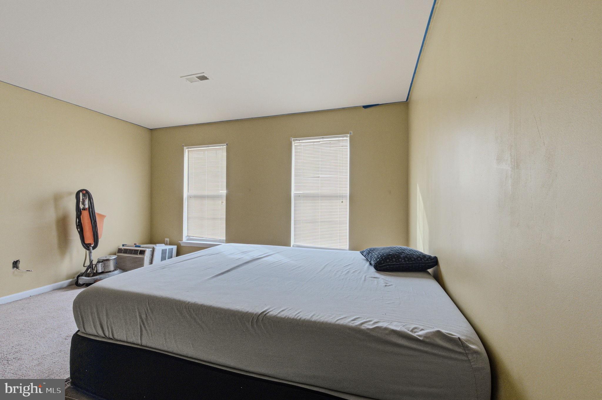 99 Jack's Way Camden, DE 19934 - Photo 25 of 30 a bedroom with a bed and a large window