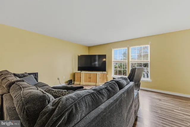 a bedroom with a bed and flat screen tv