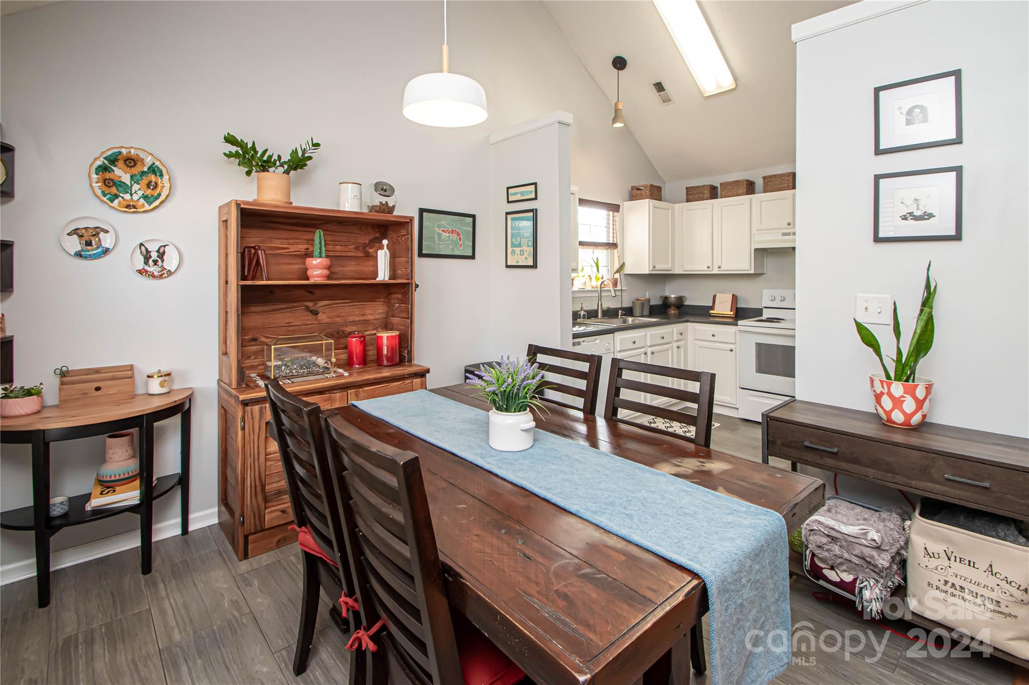 10135 Faires Farm Road Charlotte, NC 28213 - Photo 7 of 31 a view of a dining room with furniture and a kitchen