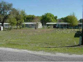 Lot 8 Southeast Lot Road Summerfield, FL 34491 - Photo 1 of 1 a front view of a house with garden
