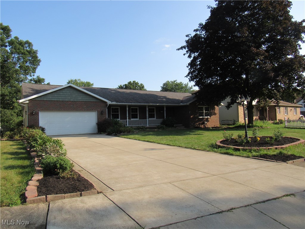 1120 Vincent Road Southeast North Canton, OH 44720 - Photo 2 of 50 Ranch-style home featuring a wide driveway - new concrete