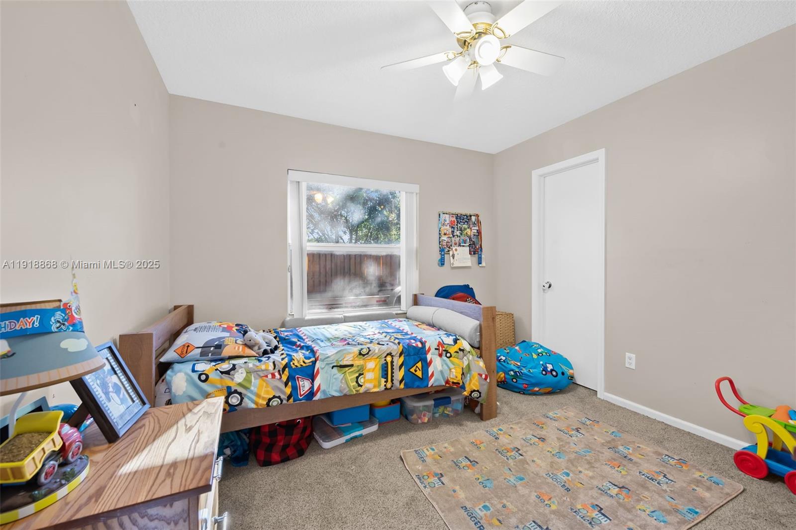 4201 Southwest 78th Drive Davie, FL 33328 - Photo 14 of 28 a bed room with bed and a window