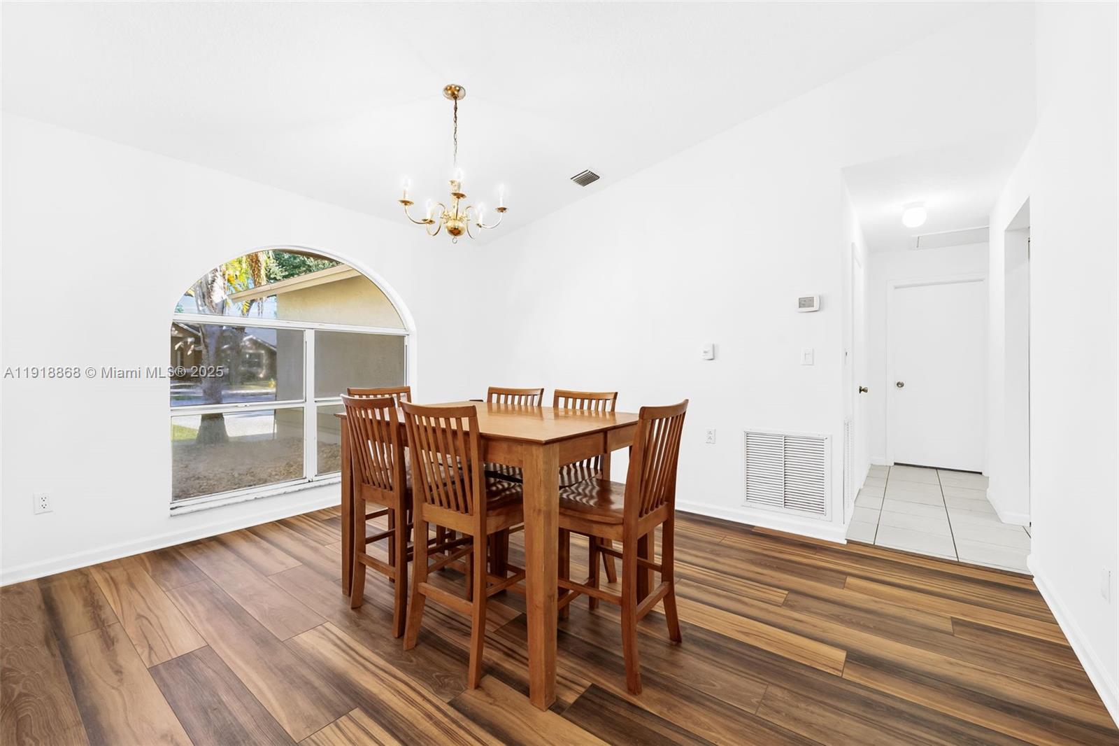 4201 Southwest 78th Drive Davie, FL 33328 - Photo 5 of 28 a view of a dining room with furniture window and wooden floor