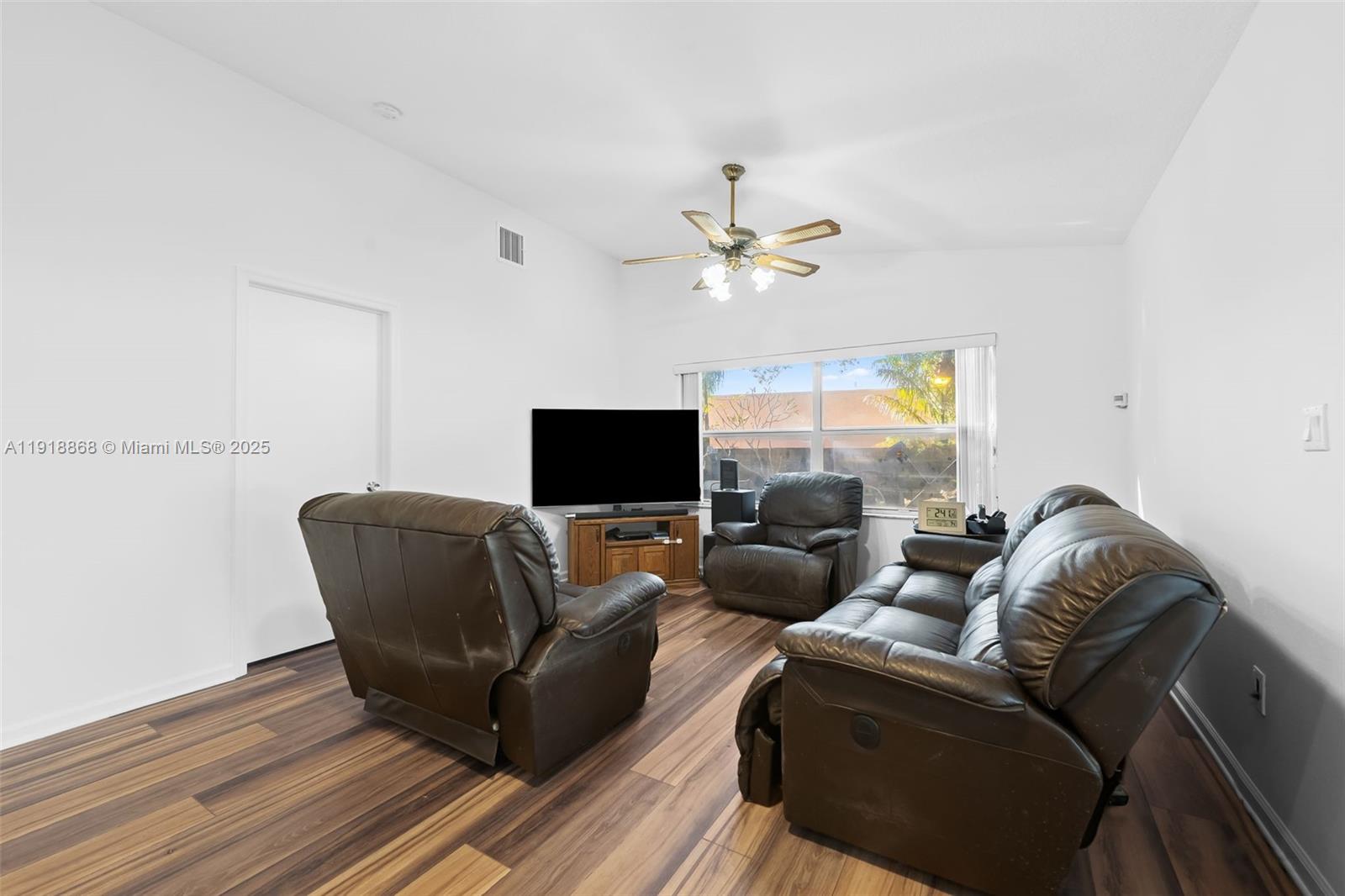 4201 Southwest 78th Drive Davie, FL 33328 - Photo 6 of 28 a living room with furniture and a flat screen tv