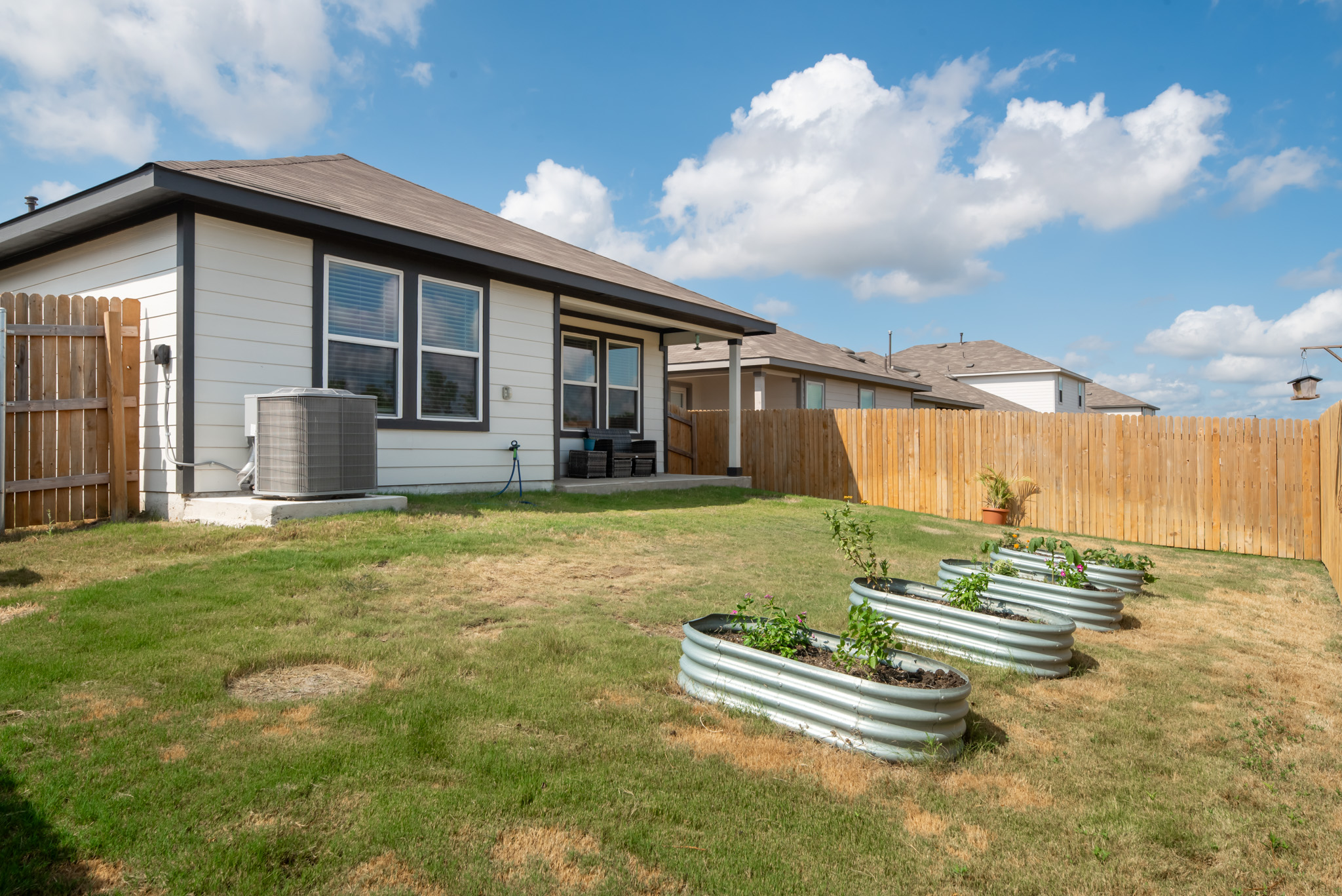165 Santa Rosa Lane Buda, TX 78610 - Photo 16 of 21 a front view of a house with a yard