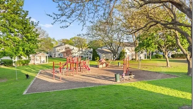 a view of outdoor space with garden and trees
