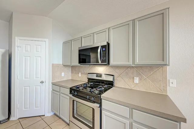 a kitchen with a sink and a window