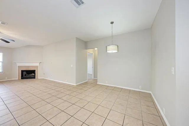 a kitchen with a refrigerator sink and cabinets