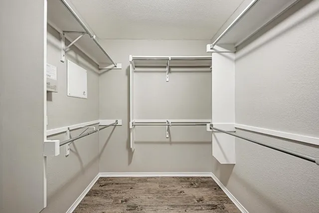 a spacious bathroom with a granite countertop tub shower and sink