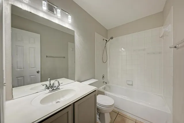 a bedroom with a large bed and a large window