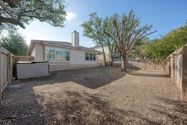 a view of a house with a tree