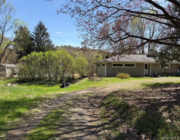 a kitchen with stainless steel appliances granite countertop a refrigerator a stove and a sink