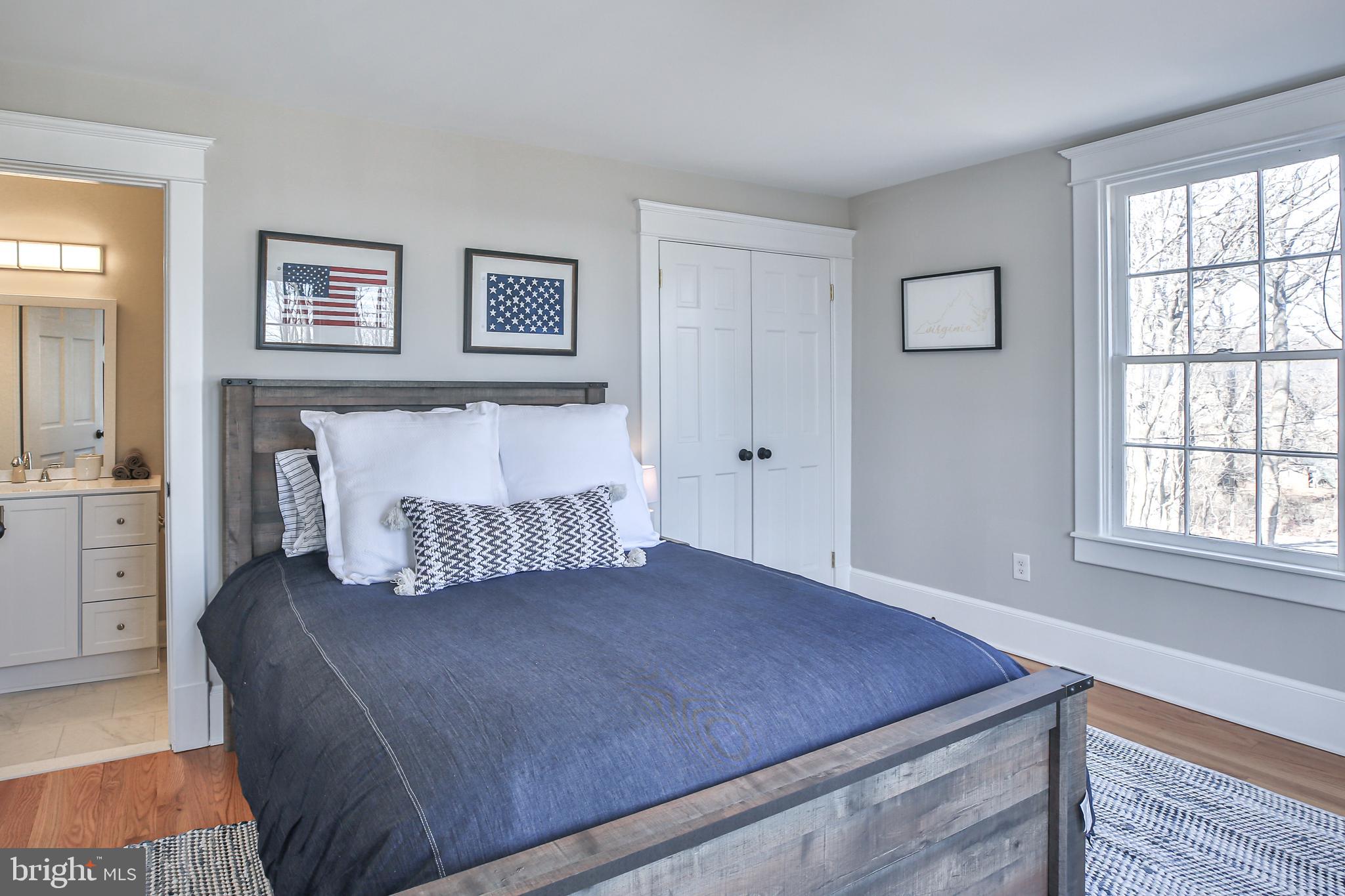 17345 Raven Rocks Road Bluemont, VA 20135 - Photo 64 of 99 a bed room with a bed and a chair