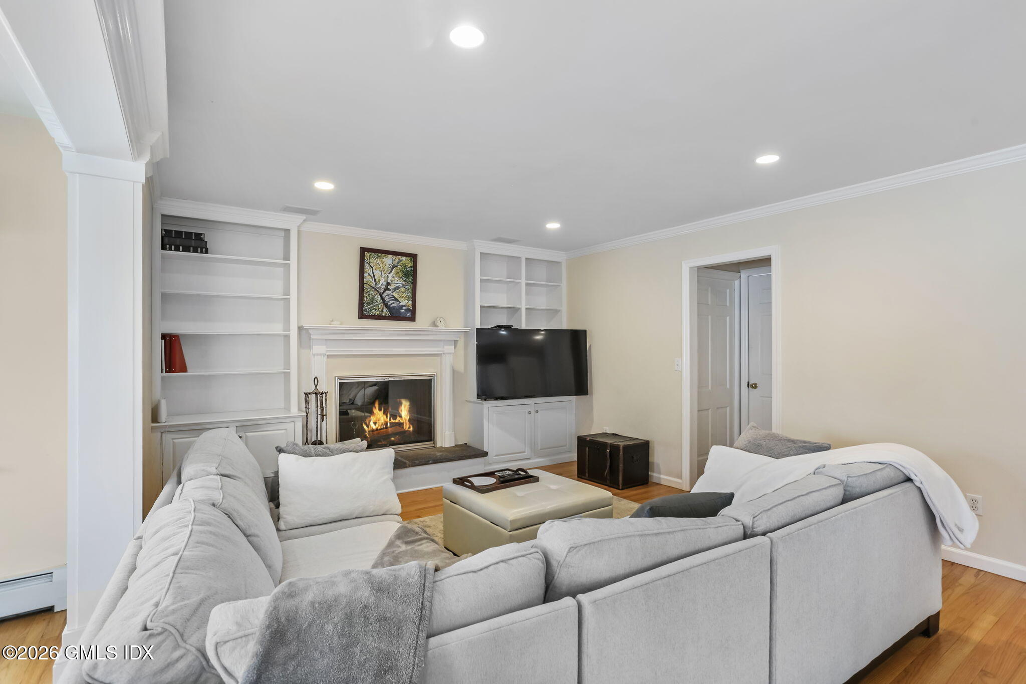 153 Lockwood Road Riverside, CT 06878 - Photo 24 of 58 a living room with furniture and a fireplace