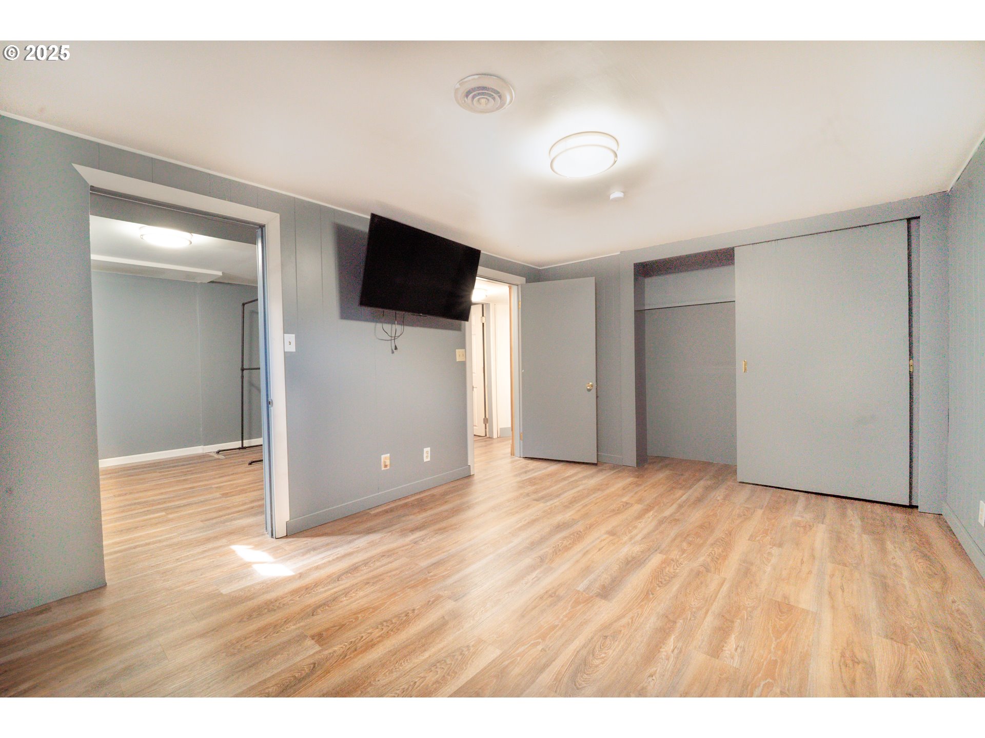 11910 Northeast Fremont Street Portland, OR 97220 - Photo 15 of 23 a view of an empty room with wooden floor and a window