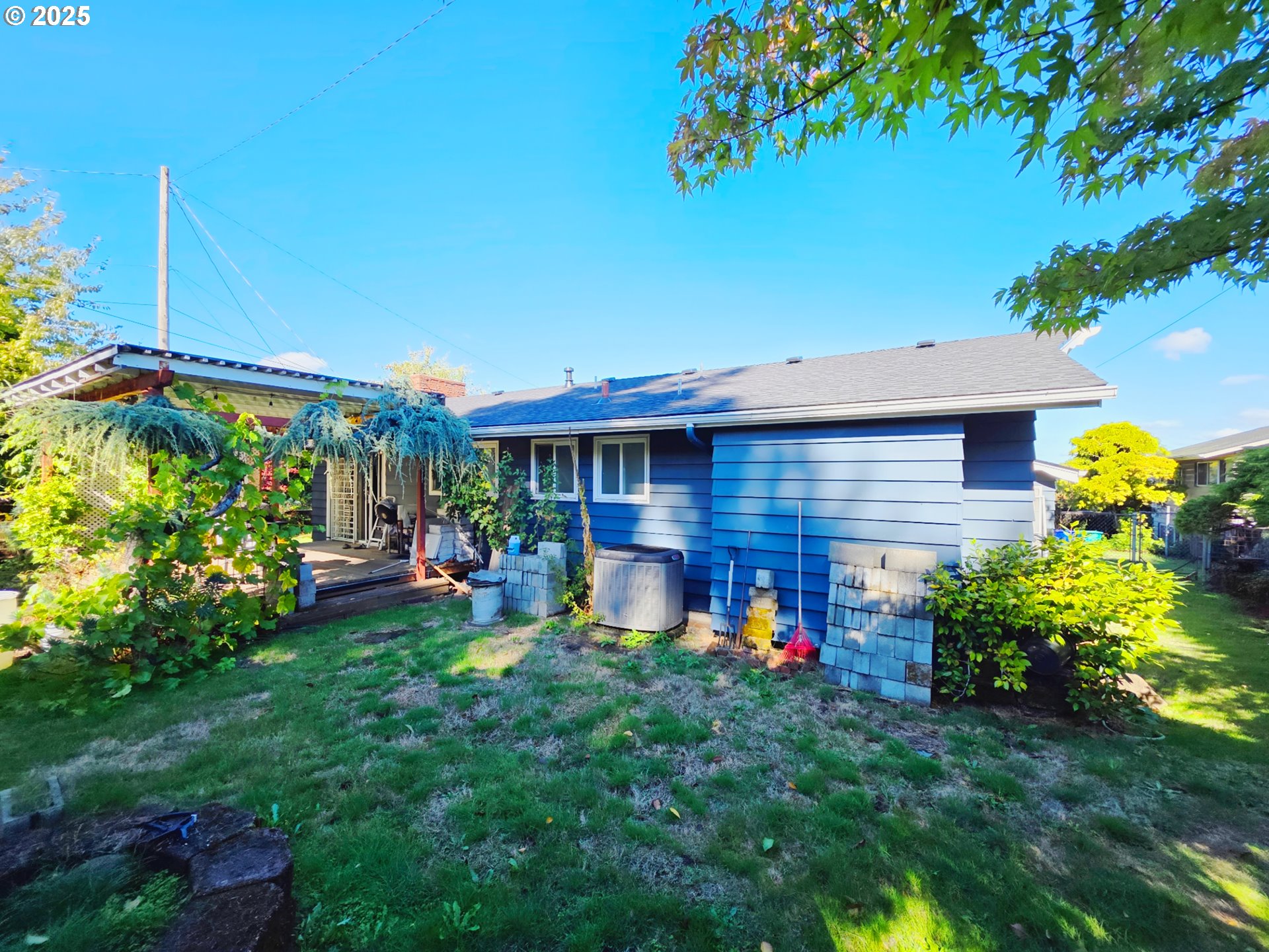 11910 Northeast Fremont Street Portland, OR 97220 - Photo 20 of 23 a view of a house with a yard and sitting area