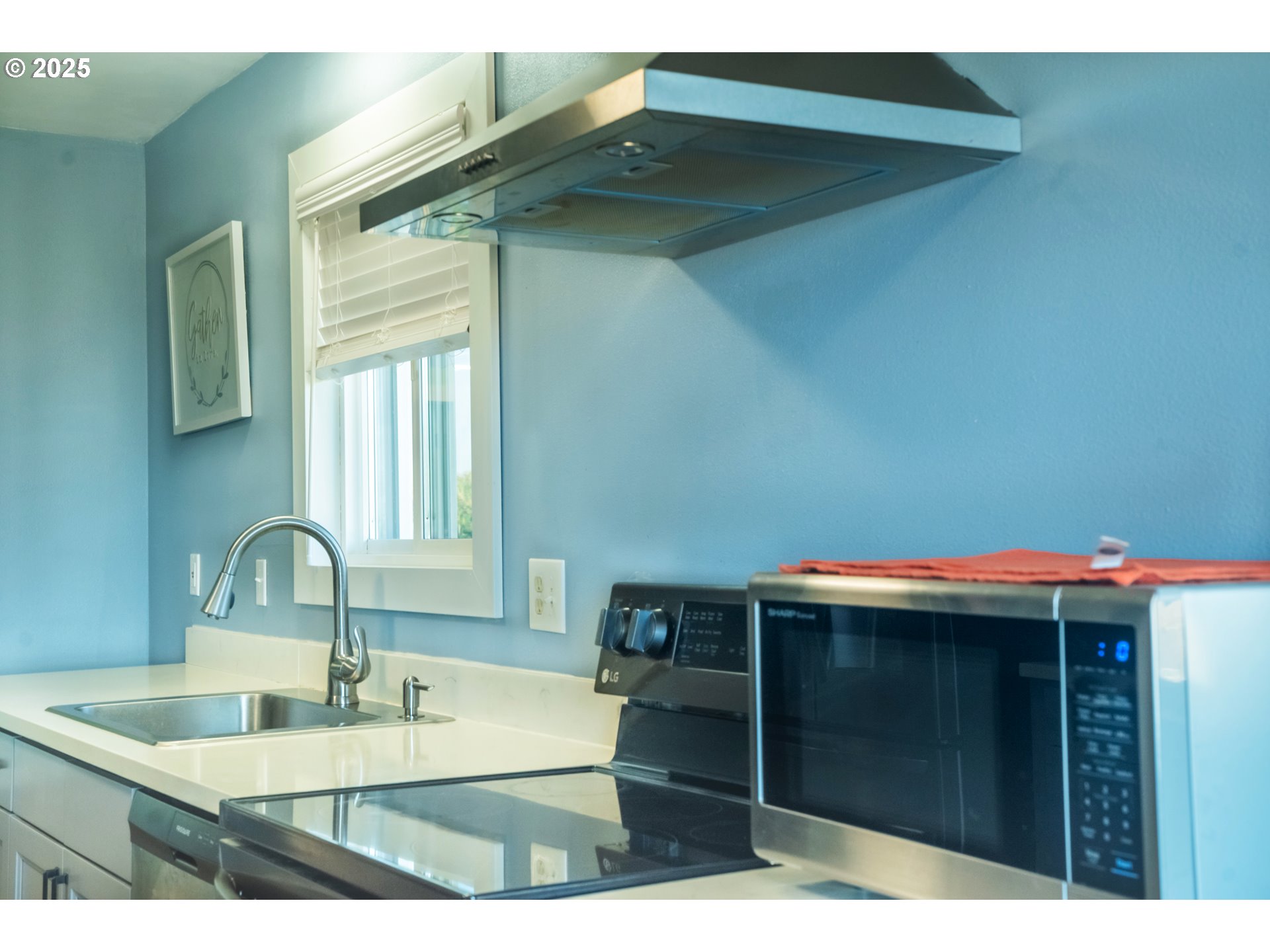11910 Northeast Fremont Street Portland, OR 97220 - Photo 7 of 23 a kitchen with a sink and cabinets