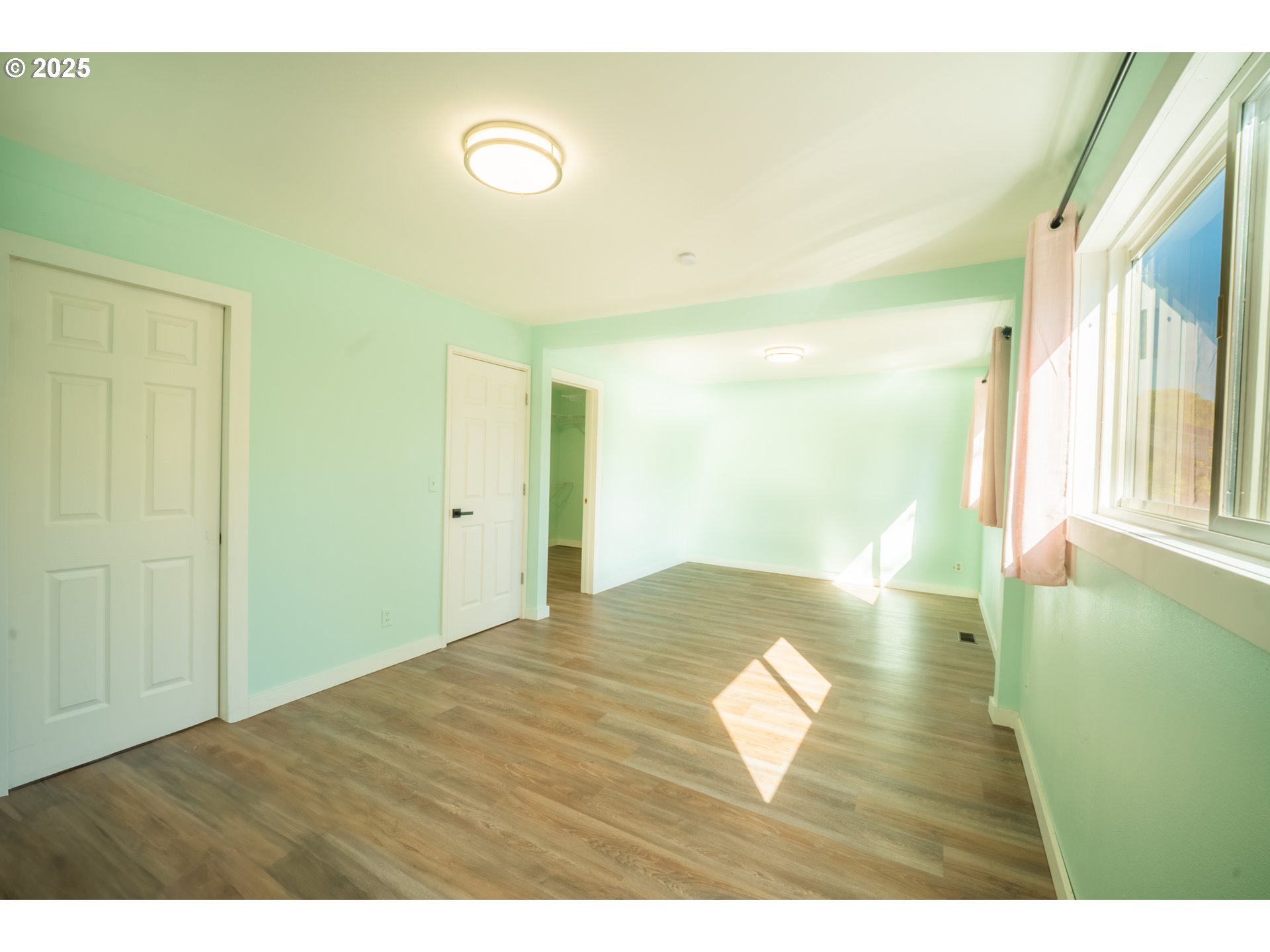 11910 Northeast Fremont Street Portland, OR 97220 - Photo 8 of 23 a view of an empty room and window