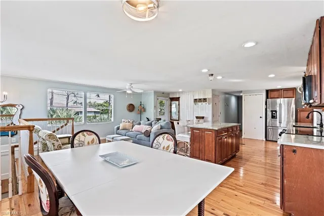 a view of a dining room with furniture and chandelier