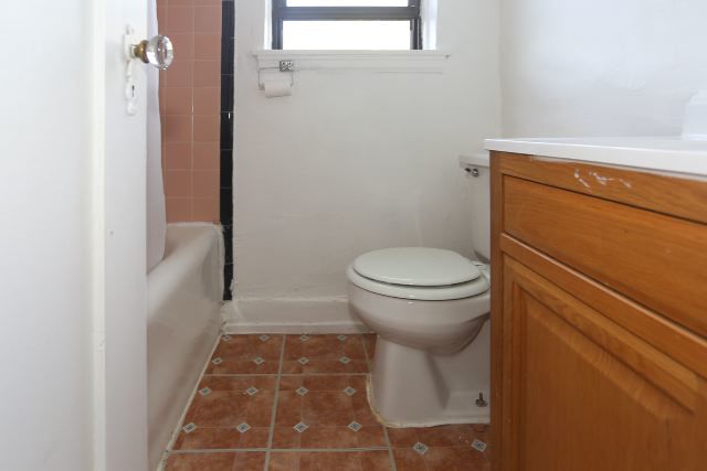 4735 North Beacon Street, Unit 411 Chicago, IL 60640 - Photo 11 of 11 a bathroom with a sink and a toilet