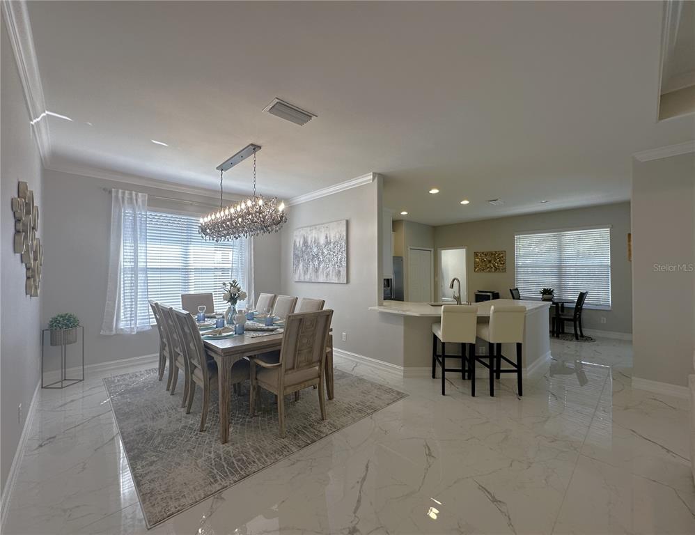 25191 Keygrass Court Punta Gorda, FL 33955 - Photo 12 of 66 a dining room with furniture and window