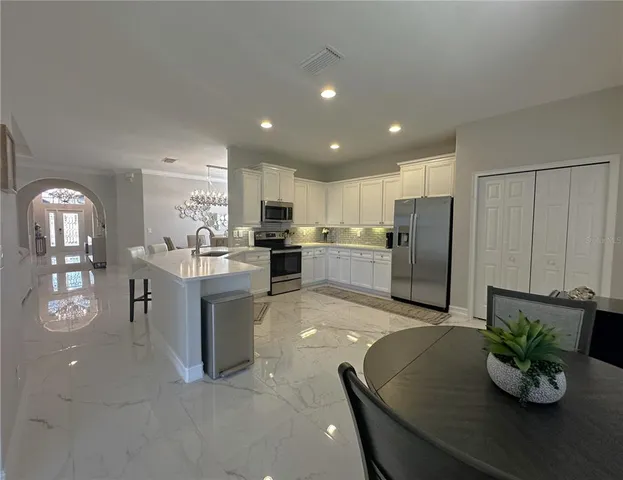 a bathroom with a sink double vanity granite and a mirror
